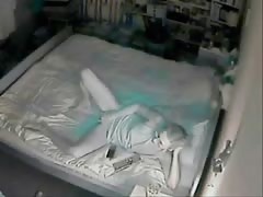 My mum masturbating on bed .Hidden cam