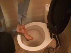 Mistress dips her dirty feet in toilet &amp; then forces her slave to lick it